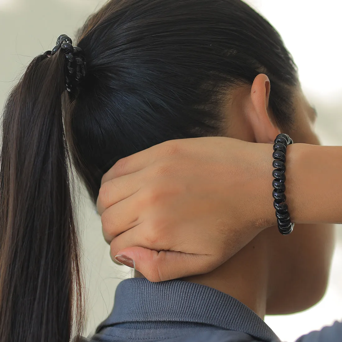 Ayesha Durable set of two black rubber bands with a unique telephone wire design.